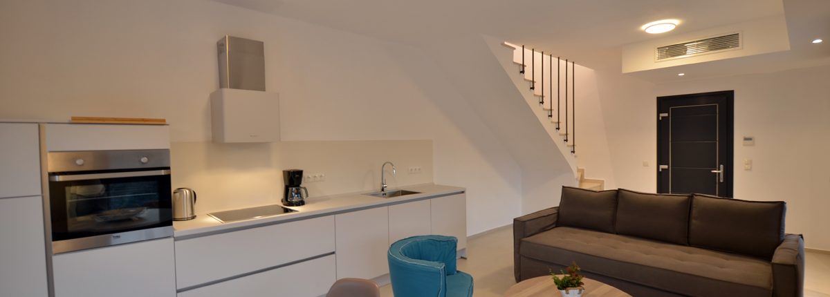 Asaya-Hills-Villas-Parga-Greece-private-villa-interior-decoration-kitchen-living-room Kitchen and living room on the ground floor of a private villa at Asaya Hills Villas, Parga, Greece.