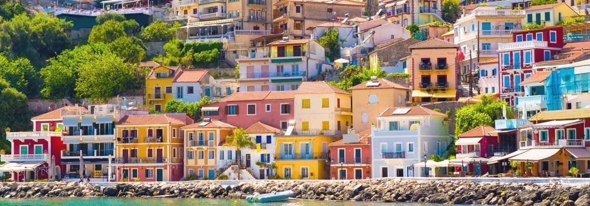 Asaya-Hills-Villas-Parga-Greece-port-colorful houses-summertime-sunny day-holidays The colorful houses on the port on a sunny day at Parga, Greece.