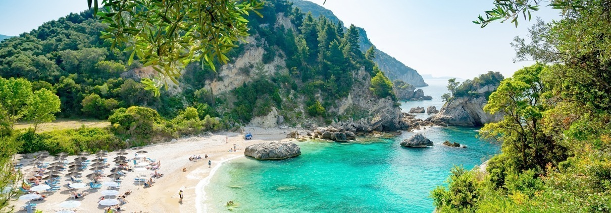 Asaya-Hills-Villas-Parga-Greece-Piso Krioneri-Beach-holidays Panoramic shot from Piso Krioneri, sand beach with umbrellas at Parga, Greece.